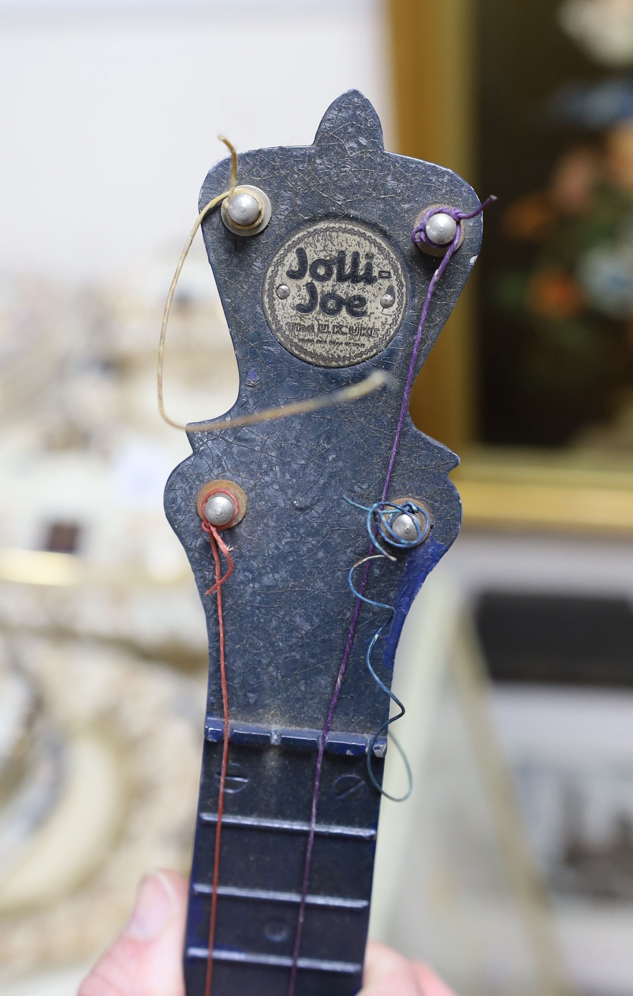 A cased Jolli Joe banjo